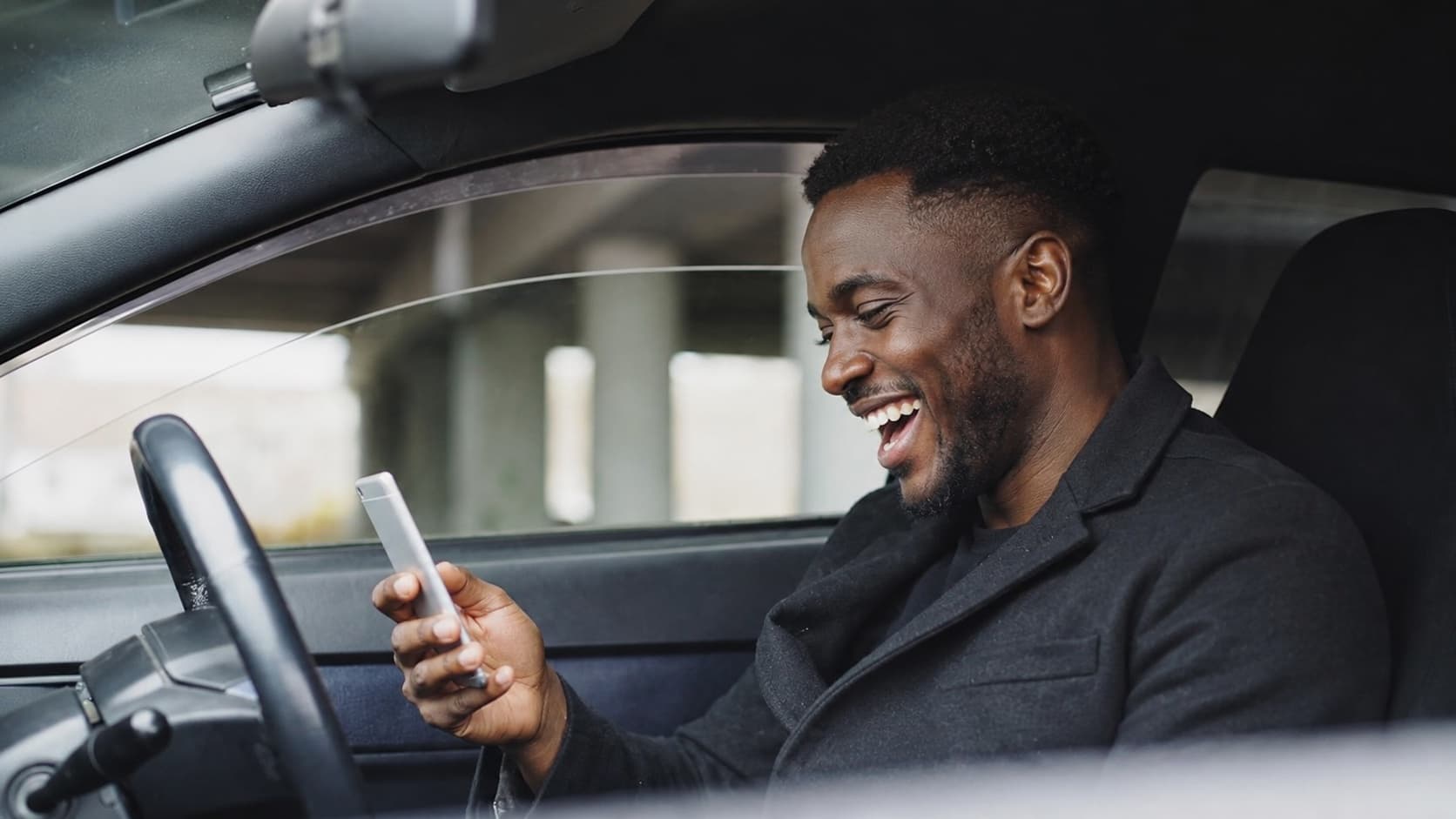 Fleet manager checking WhatsApp on a phone